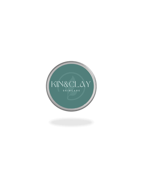 Closed aluminum tin of Kin & Clay Coconut Lip Balm with teal branded label